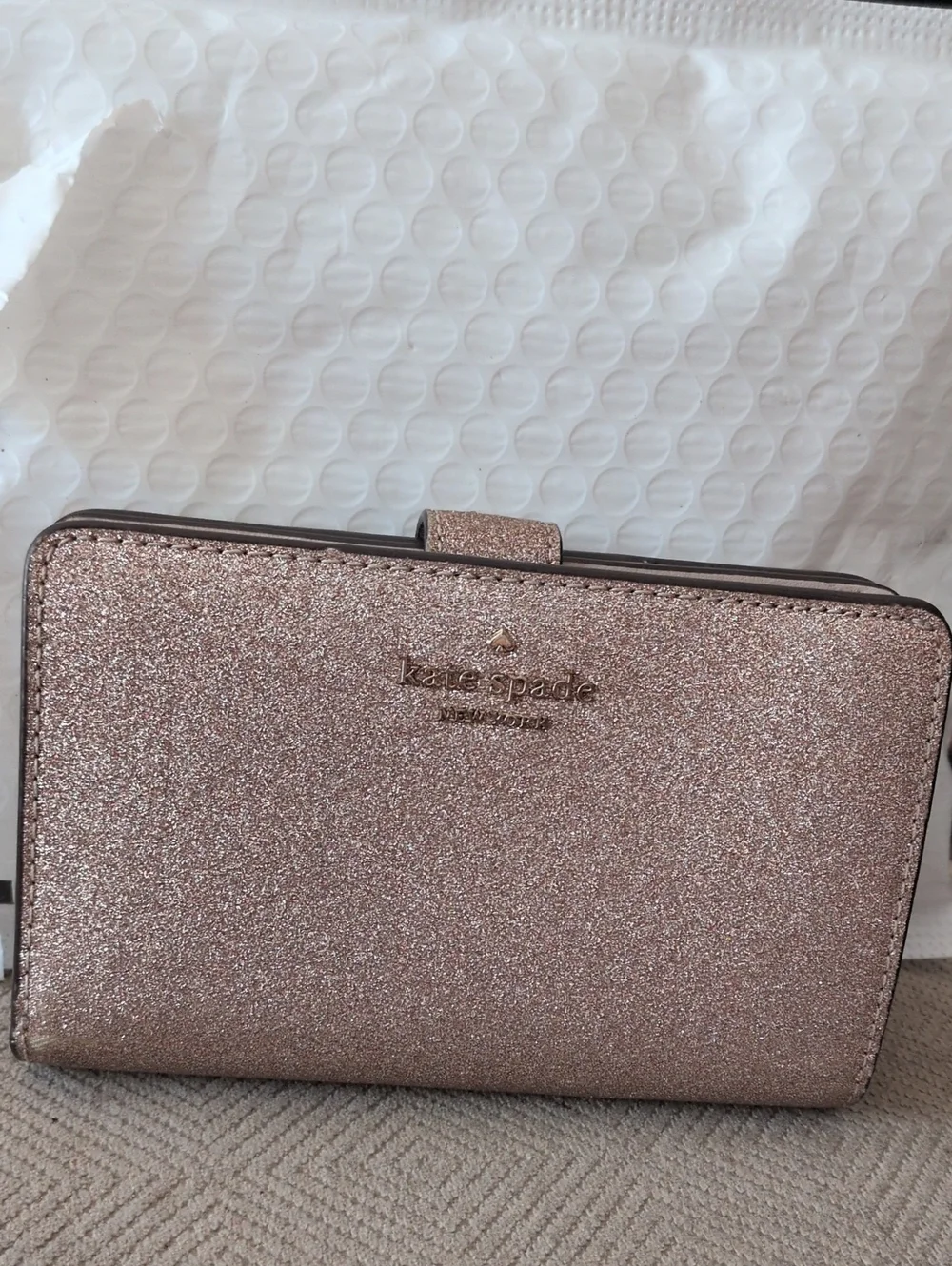 kate spade glitter wallet in rose gold shimmer